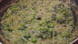 Add water to the gravy in methi mattar malai recipe
