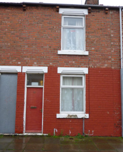 A red doored house used to house asylum seekers in the Gresham area of Middlesbrough (© John Grayson)
