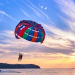 parasailing-at-sunset-with-island-in-background