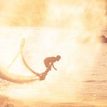 silhouette-of-flyboarder-with-spray-from-ocean