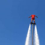 blue-sky-flyboarder-wearing-red
