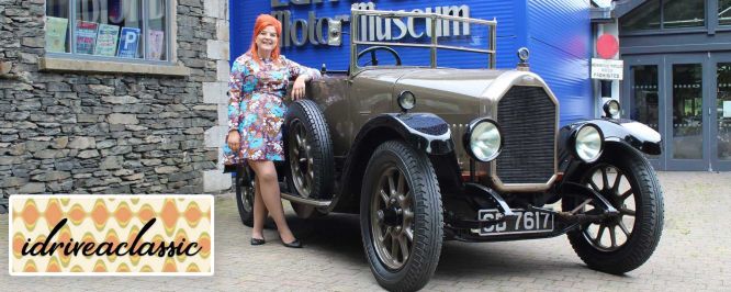 Steph from "IDriveAClassic" outside the Lakeland Motor Museum entrance