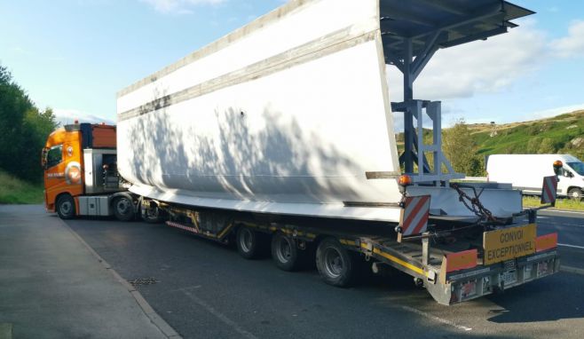 A section of the new ship being transported to Lakeside Pier