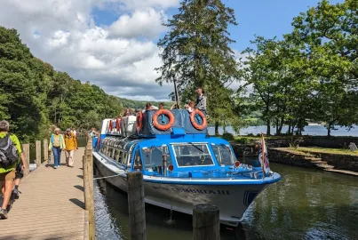 A boat at Wray Jetty with passengers disembarking.