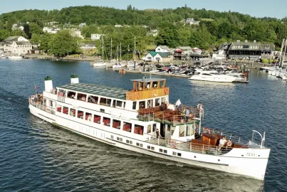 MV Teal departing Bowness Pier on an evening cruise.