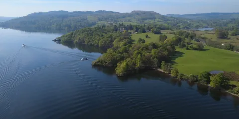 Our modern launches sailing past Wray estate