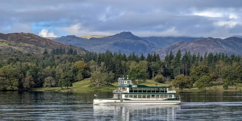 MV Swift with Lakeland Fells behind
