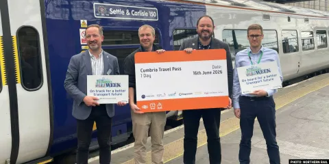 Four stakeholders of Northern Rail hold an oversized ticket at the launch of the new Cumbria Pass
