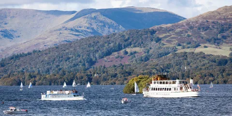 A historic stemaer and modern launch on Lake Windermere