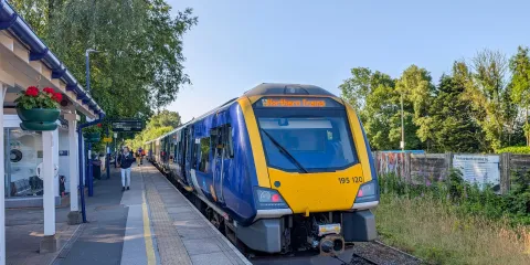 A train waiting for passengers at Winderemre station
