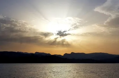 Langdale Pikes silhoetted in front sunset