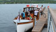 Cyclists arriving at Bark Ban Jetty on the Windermere Bike Boat
