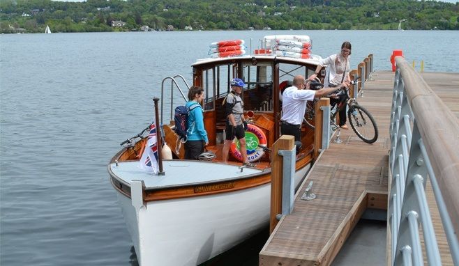 Cyclists arriving at Bark Ban Jetty on the Windermere Bike Boat