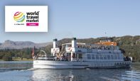 World Travel Market logo superimposed over a lake and view