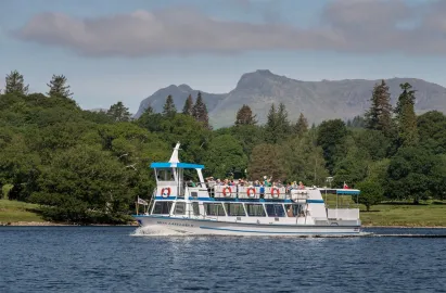 Miss Lakeland II on the Red Cruise with Langdale Pikes behind