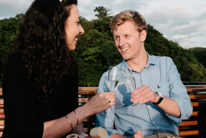 A couple enjoy a drink on board the Summer Evening Buffet Cruise