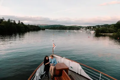 A couple on the outer decks of lakeland Steamer MV Swan