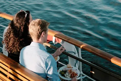 A couple enjoy the view from the outer decks