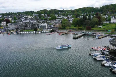 Modern launch coming in to Bowness Bay