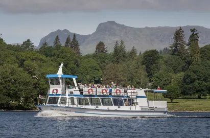 Modern launch and the Langdale Pikes in the distance