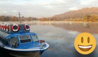 Smiley face emoji with a boat in the background at Ambleside