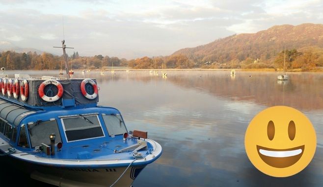 Smiley face emoji with a boat in the background at Ambleside