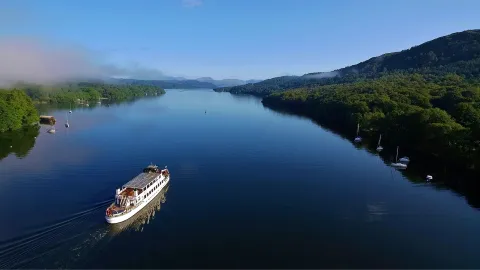 Highlight the beauty of the region and England’s stunning longest lake.