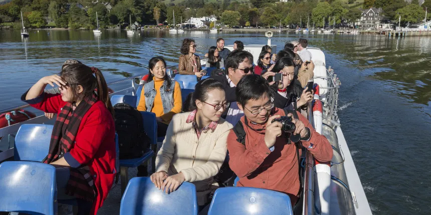Chinese visitors on Windermere lake