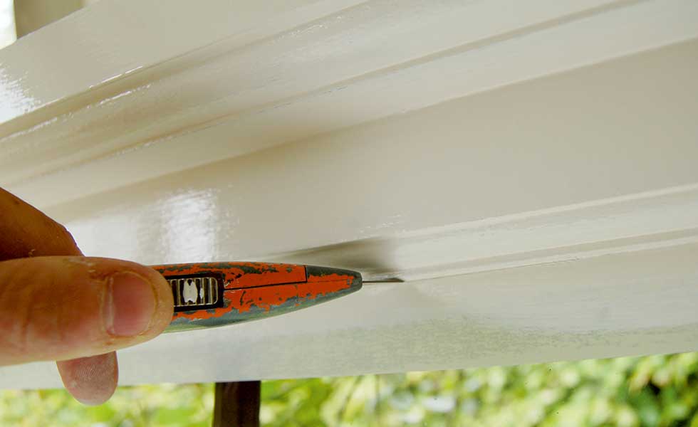 cutting the masking tape with a stanley knife