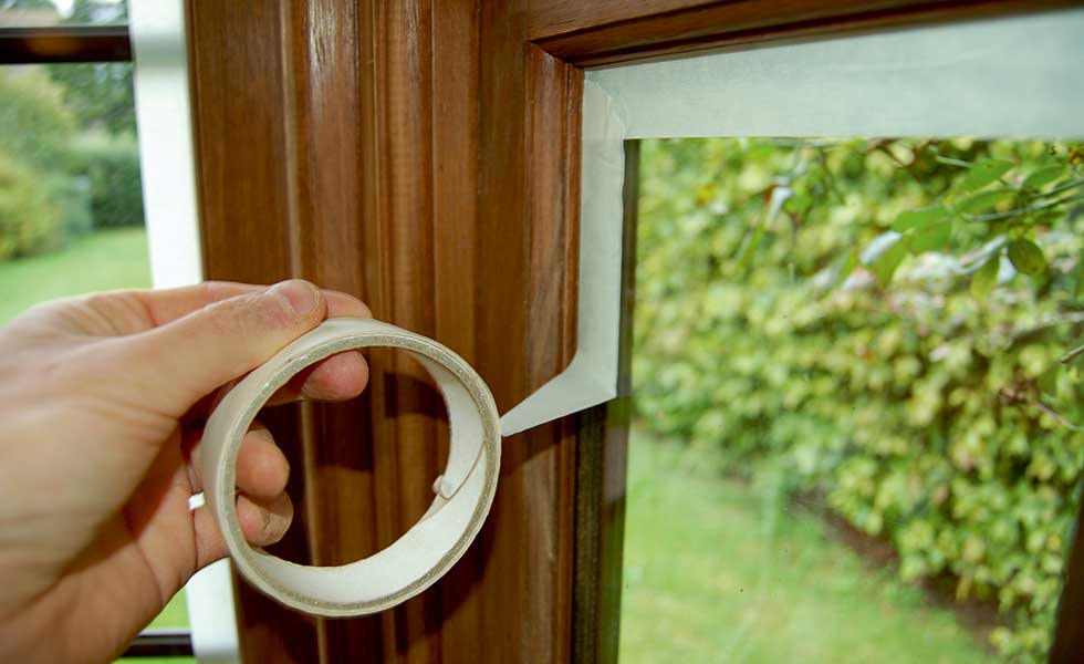 masking tape round windows