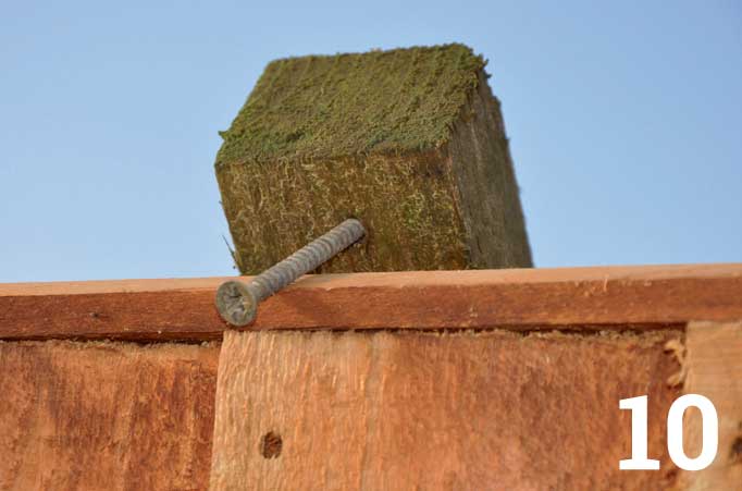 A screw through the top of the batten forms a neat hook that stops the panel from moving