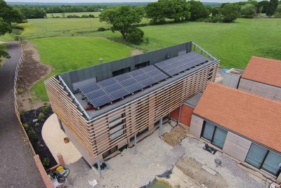 PVT system installed on the roof of a modern timber home