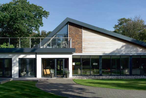 Low-impact self-build glulam post and beam structure clad in western red cedar
