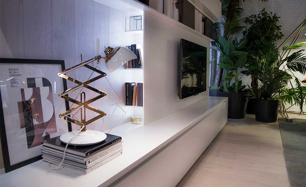 Contemporary sleek white living room storage with retro side lamp
