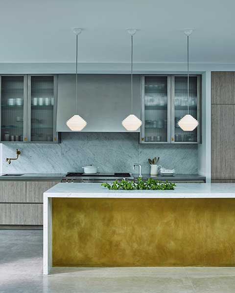 Kitchen island with three low level pendants