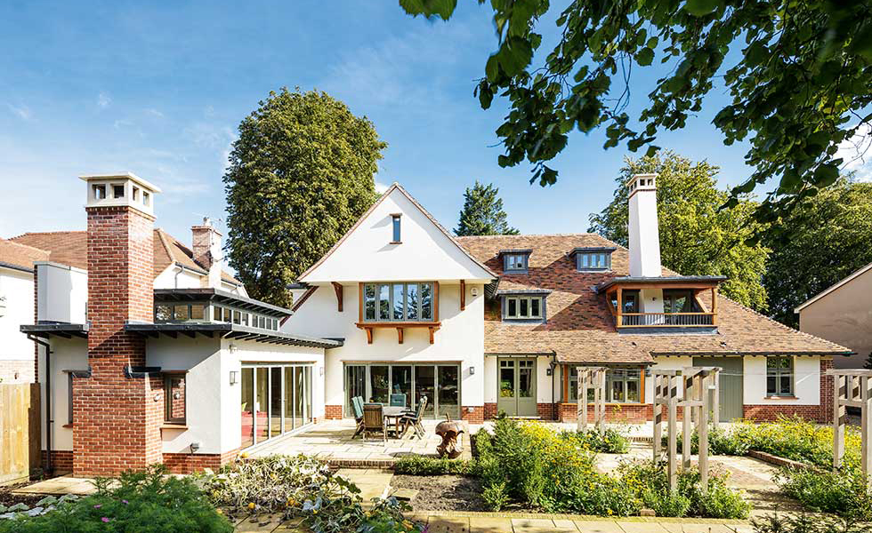arts and crafts house with dormer windows