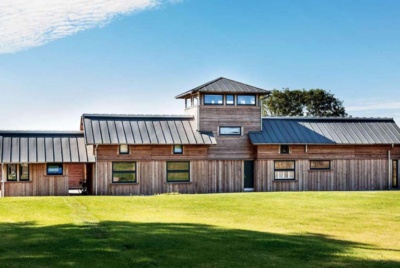 Metal roof on contemporary self build timber frame farmhouse