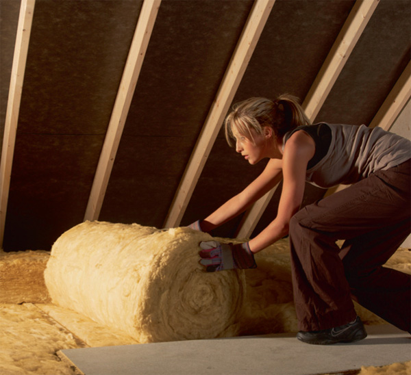 lady laying insulation