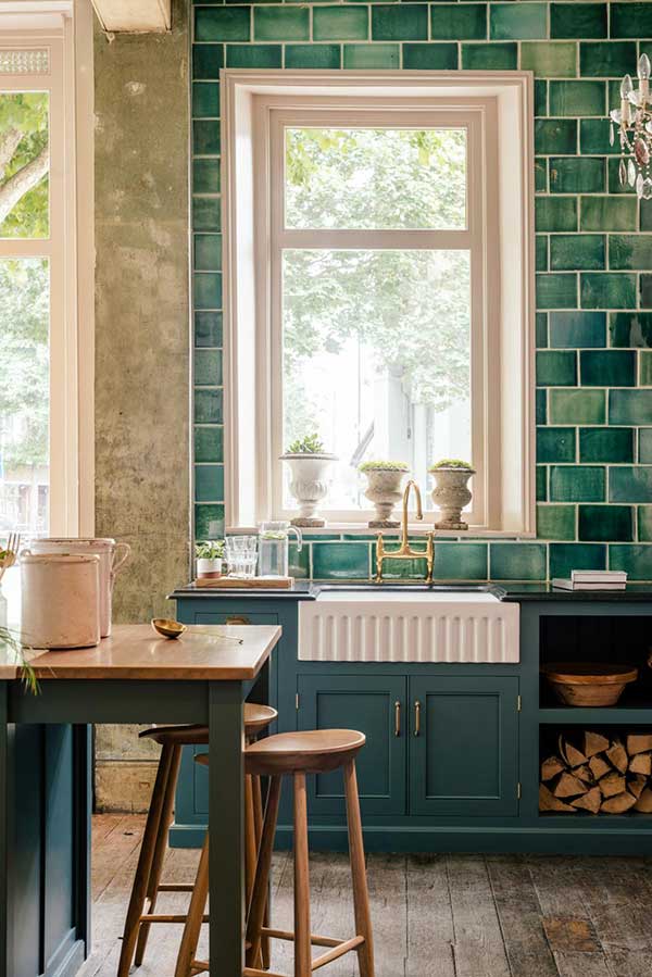 kitchen with blue tiles and ceramic sink