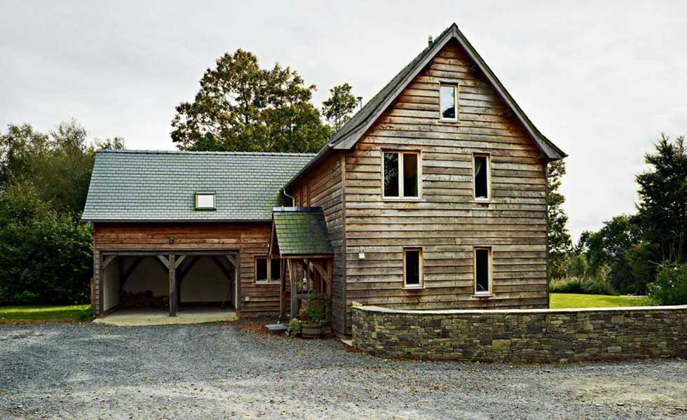 gravel driveway to a timber frame home