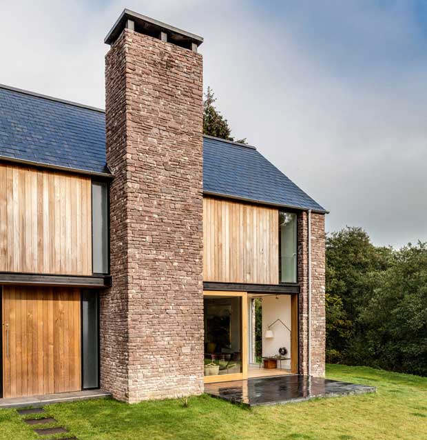 Today, powerful chimney stacks are back in vogue, as on this new Hall + Bednarczyk Architects barn-style home