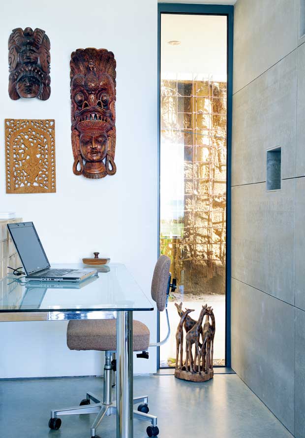 Full height vetical window provides light in the study