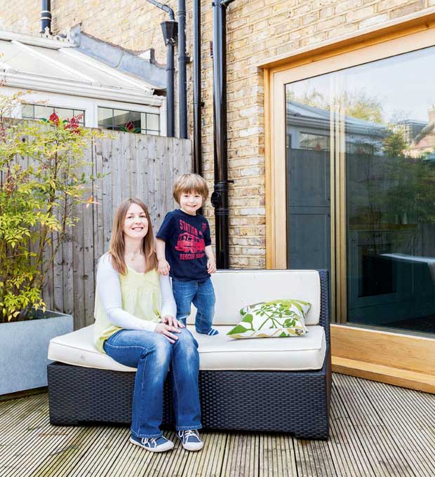 Hannah and her son Oliver in the garden of their Victorian home