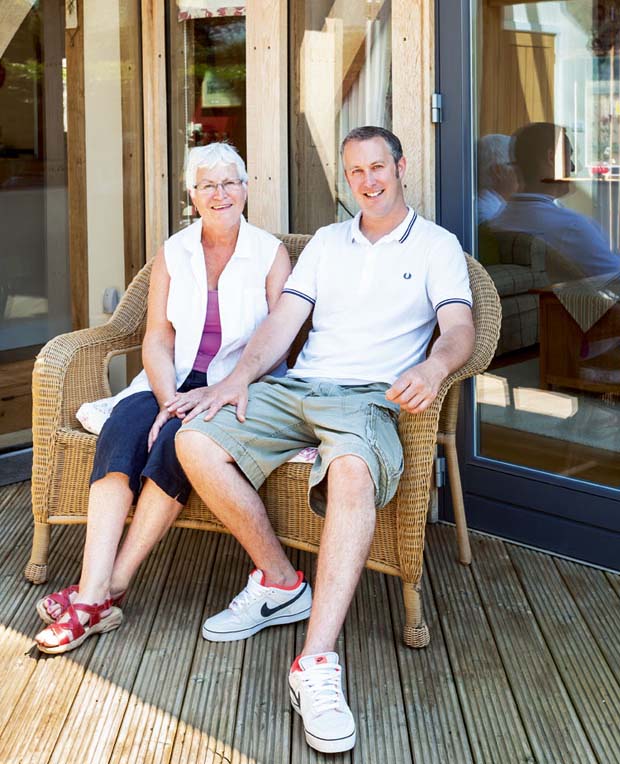 Sue and Matthew Crowe infront of new oak home