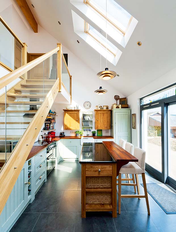 The wooden open flight staircase in the kitchen