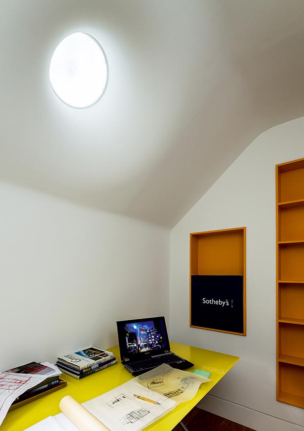 A light pipe brings natural light to a basement office