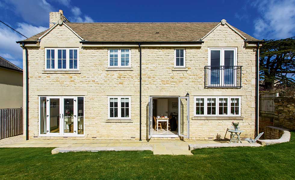 A Cotswold stone home with juliet balcony and french doors