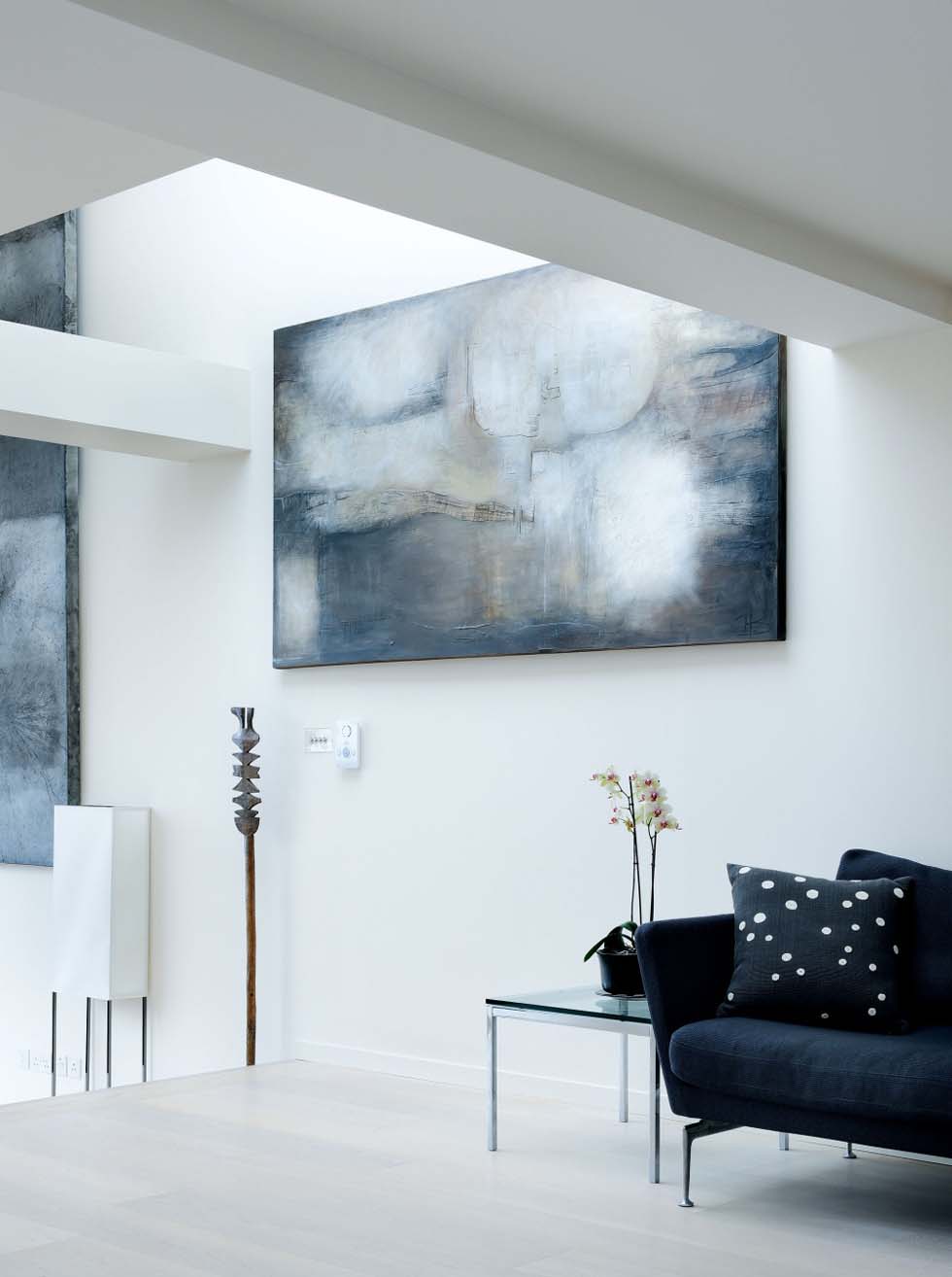 A painting acts as a focal point to this seating area