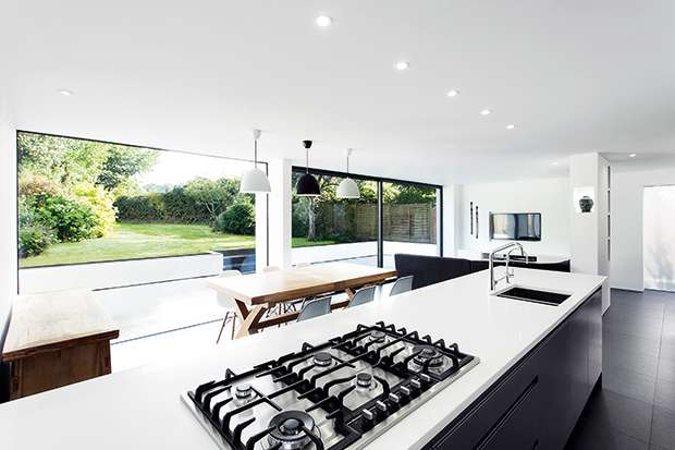 an open plan kitchen living and dining room in an extension to 1950s home