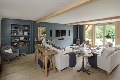 Living room sizes can be hard to get right with striking a balance between cosy and inviting as well as providing room for entertaining. This oak frame self build offers enough space for lounging and relaxing